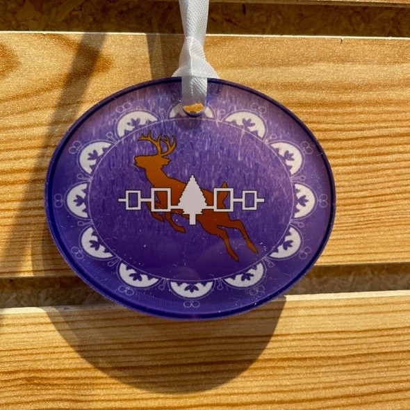 Purple Oval with deer in the middle. A beautiful, high-quality Acrylic Suncatcher Ornament featuring our Haudenosaunee designs. These unique ornaments are handmade and made of durable 1/4" thick acrylic. They're the perfect way to bring color and culture to your home or office!