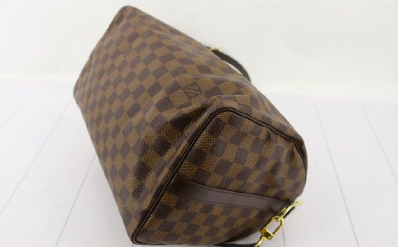 Style Encore - Maple Grove, MN - Louis Vuitton Speedy 30 in Damier Ebene!  This bag does have some ink marks and staining on the inside but comes with  a base shaper