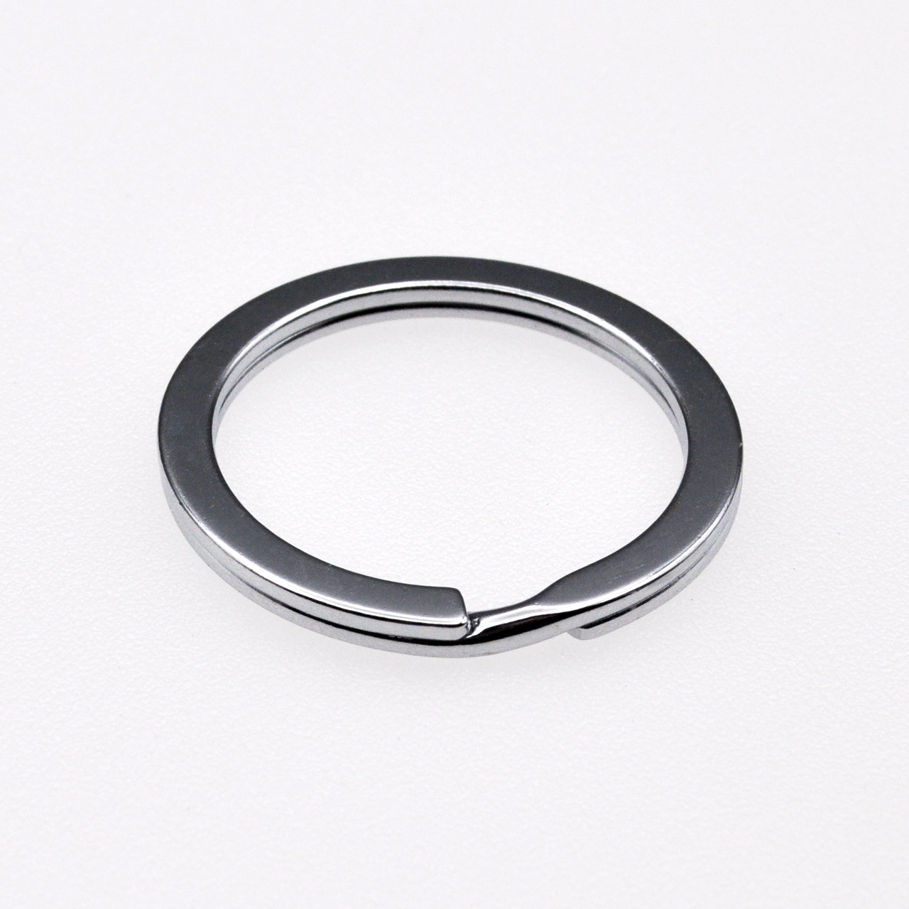 https://cdn11.bigcommerce.com/s-k4as3uan8i/images/stencil/1280x1280/products/751/5298/910330-Flat-Split-Key-Ring-Nickel-Plated__59829.1627488299.jpg?c=1