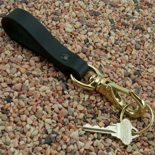 Black Leather Belt Key Holder Strap with Brass Boat Snap Super Duty - Riveted laying on rocks with key on the split key ring