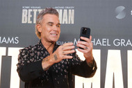 What did Robbie Williams have done to his teeth?