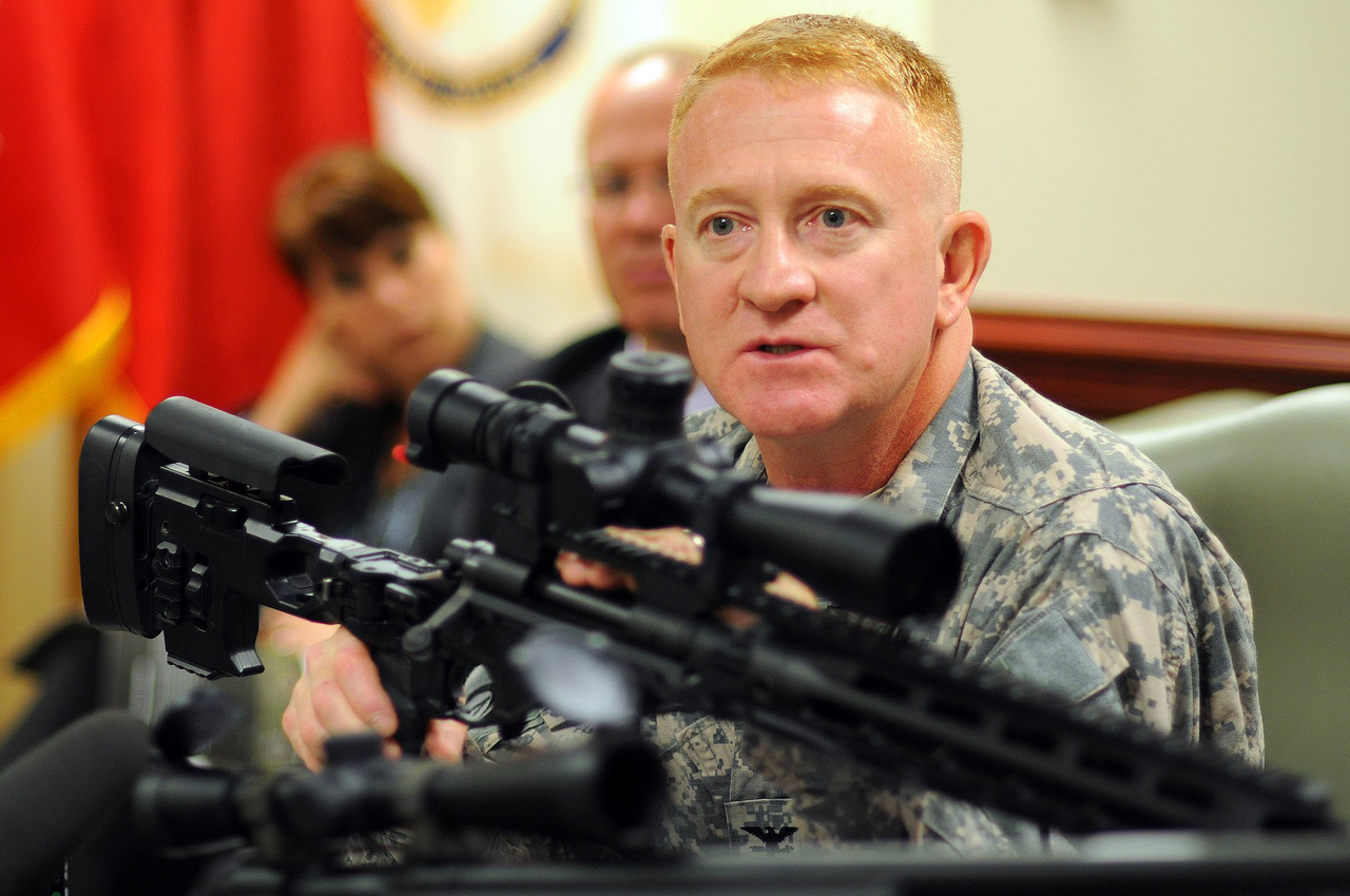 U.S. Army Project Manager for Soldier Weapons Colonel Douglas Tamilio with the XM2010 in 2010