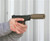 Fly9 TBAC suppressor on a gun with man shooting