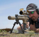 sniper with a 7.62 rifle aith HUXWRX Flow 762 Ti Suppressor in FDE