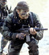A SEAL during training with a Colt Commando.