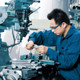 machinist handling AR15 receivers