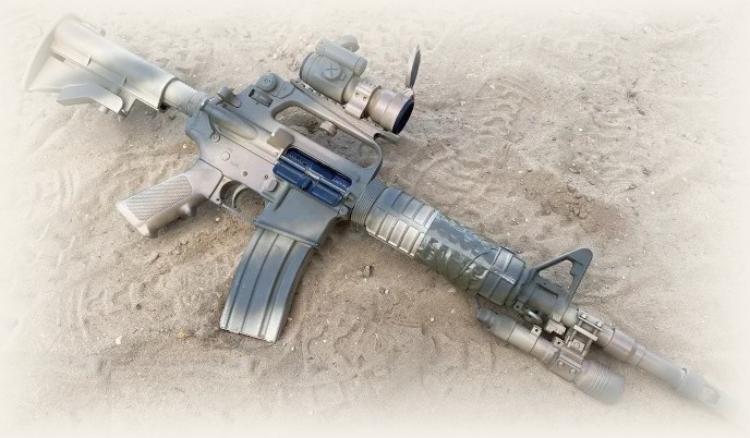 Delta-era A2 carry-handle carbine configured with optic, weapon light and M4-Delta suppressor