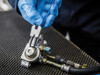 BlueSpot Tools 150mm external bent 90 degree circlip pliers being used on a mechanical component