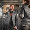 Scruffs Worker Bodywarmer Graphite worn over hoodie showing front zip closure and chest pocket