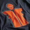 Scruffs Houghton Worker T-Shirt close-up of large orange worker icon graphic print on navy fabric