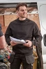 Scruffs Worker Sweatshirt black worn by tradesman showing crew neck, ribbed cuffs and Scruffs workwear branding