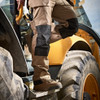 Scruffs Worker Plus Stone Trousers worn by tradesperson climbing into machinery
