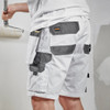 White Scruffs Worker Plus Holster Shorts being worn, showing reinforced rear pockets and practical workwear fit