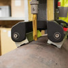 HMT V60T Versadrive Pipe Twin Magnetic Drill – magnetic drill bit cutting a steel beam between two rollers