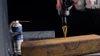HMT VersaDrive Step Drill - Imperial showing gold step drill positioned over steel box section with cutting lubricant
