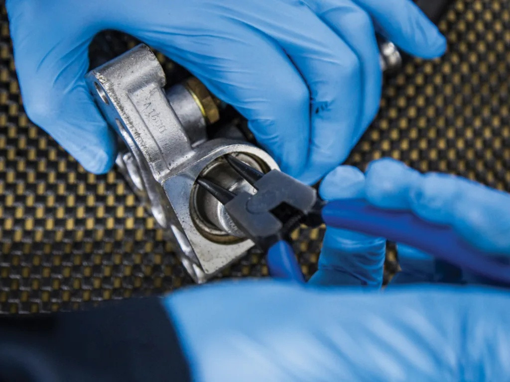 BlueSpot Tools 150mm internal straight circlip pliers being used to remove a circlip from a metal component