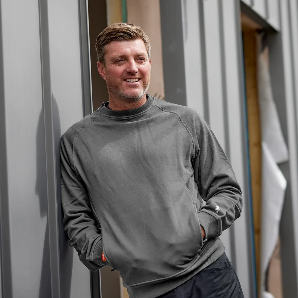 Scruffs Worker Sweatshirt grey workwear worn on site showing crew neck, long sleeves and relaxed work fit