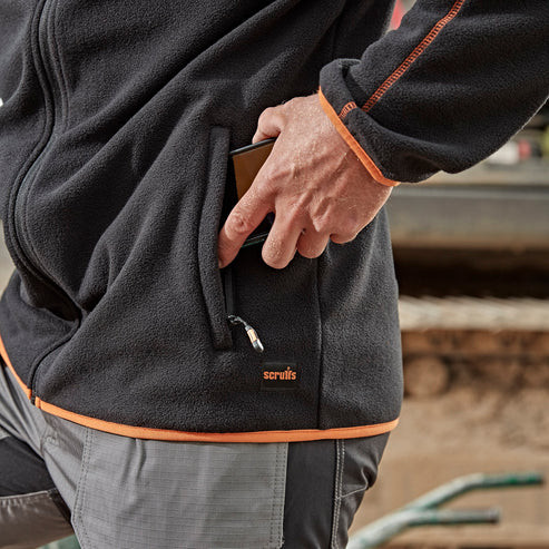 Scruffs Harbour Microfibre worn outdoors showing zipped side pocket and orange contrast trim