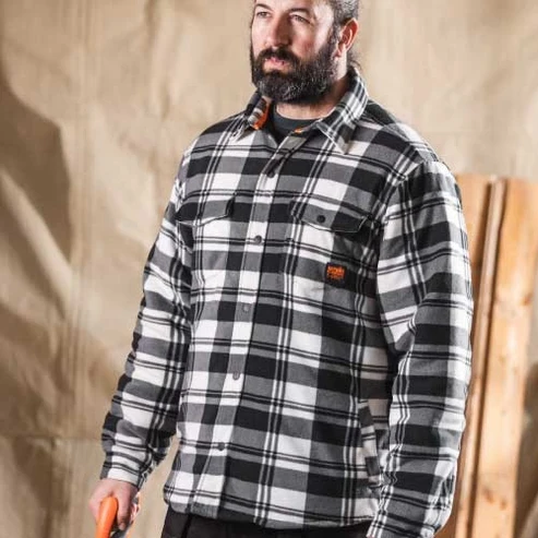 Scruffs Worker Black and White Padded Checkered Shirt worn by tradesperson indoors showing check pattern and chest pockets