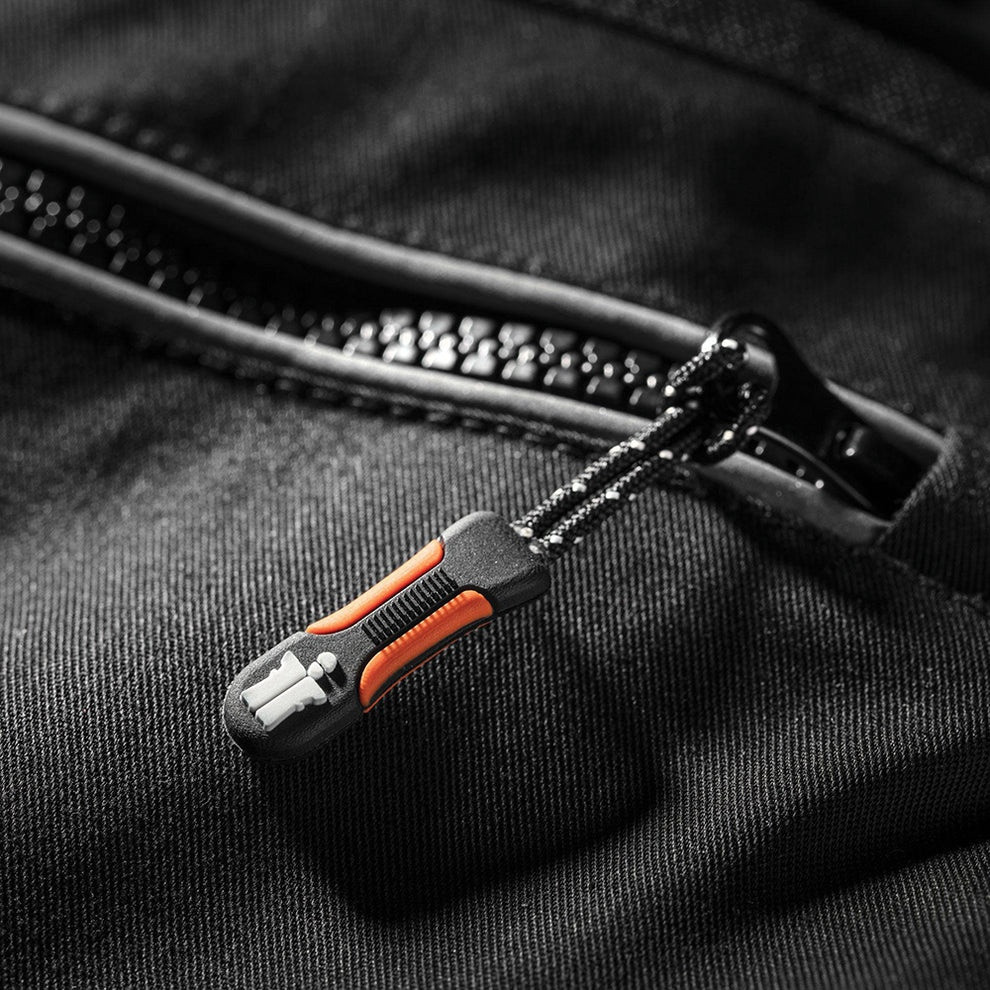 Scruffs Trade Flex Trousers close-up of zipped pocket with orange zip pull