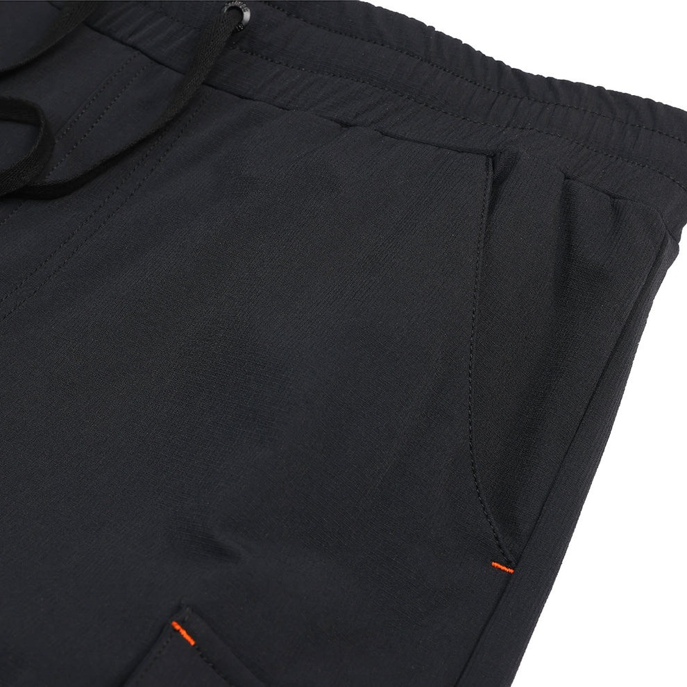 Scruffs Tech Hybrid Jogger close-up showing front pocket and orange stitch details