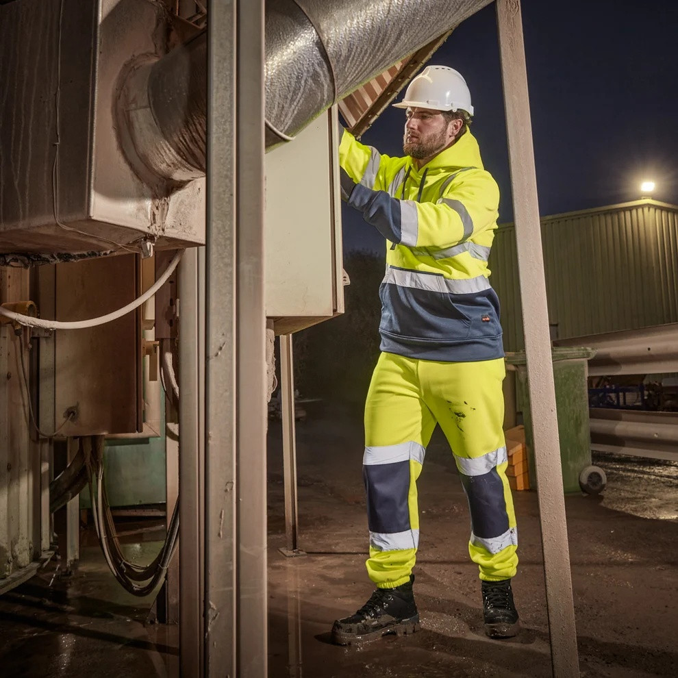Scruffs High Visibility Jogger worn by worker at night in industrial setting