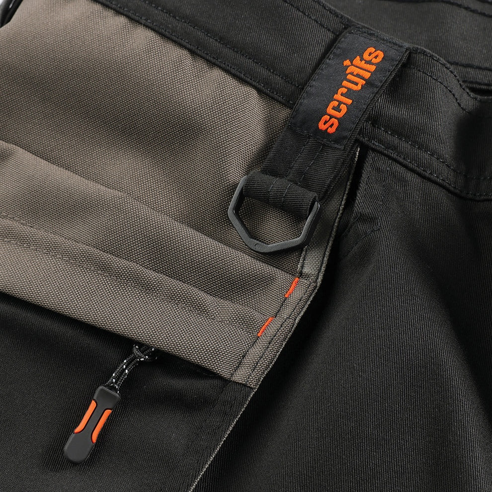 Close-up of Scruffs Worker Plus Holster Shorts branded utility loop, zip pull and reinforced pocket fabric