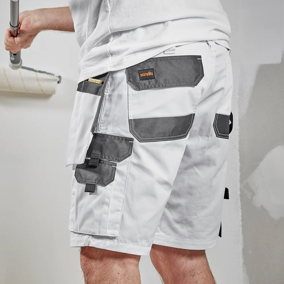 White Scruffs Worker Plus Holster Shorts being worn, showing reinforced rear pockets and practical workwear fit