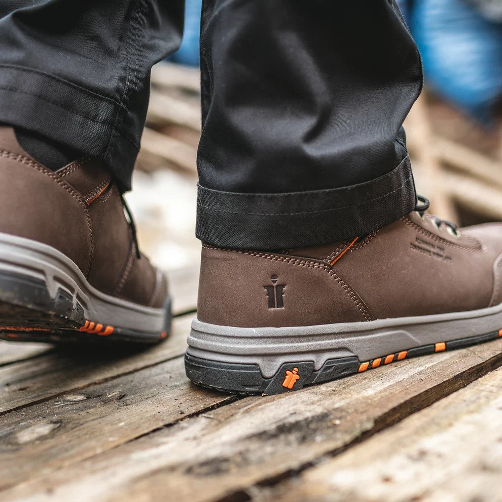 Scruffs Switchback 3 Safety Boots Ã¢â‚¬â€œ brown safety boots worn on timber showing heel branding