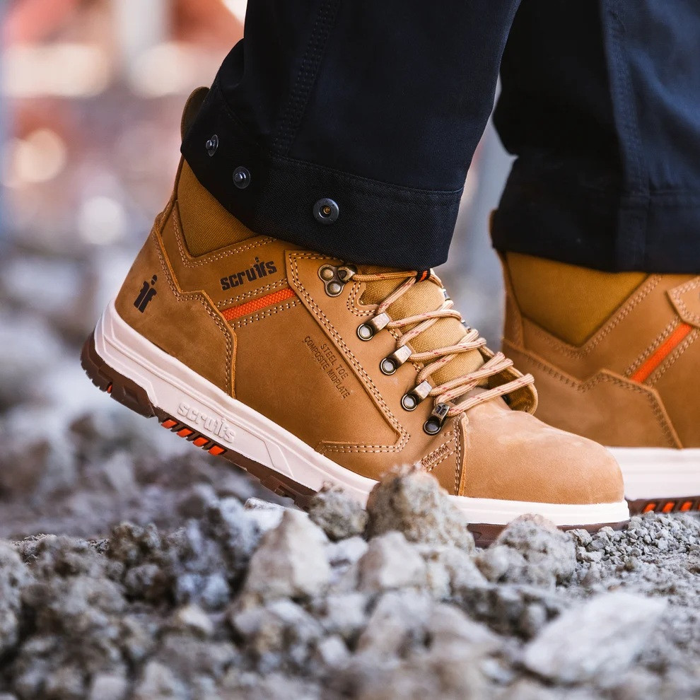 Scruffs Nevis Safety Boots ÃƒÂ¢Ã¢â€šÂ¬Ã¢â‚¬Å“ close-up of tan safety boots worn on rubble