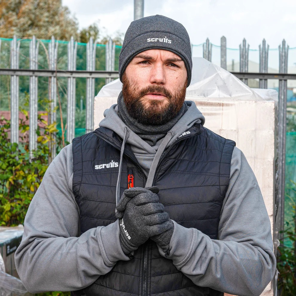Scruffs Pro Winter Essentials Pack worn outdoors, showing black beanie, neck warmer and gloves