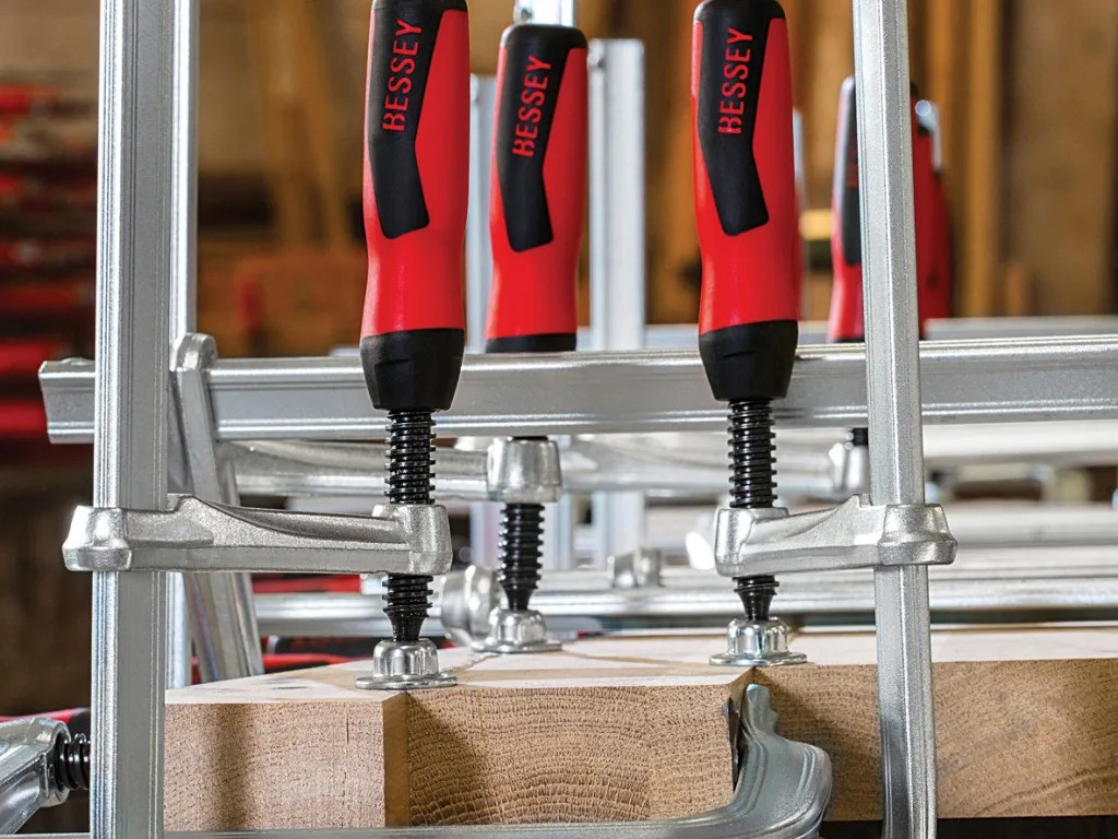 Bessey GZ All-Steel Screw Clamp – multiple all-steel screw clamps holding a precision workpiece