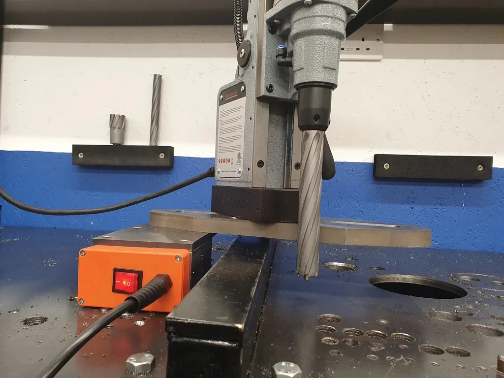 HMT OverReach 50 Magnet Base Clamp with Slide Plate – overreach magnetic drill attachment being used on steel