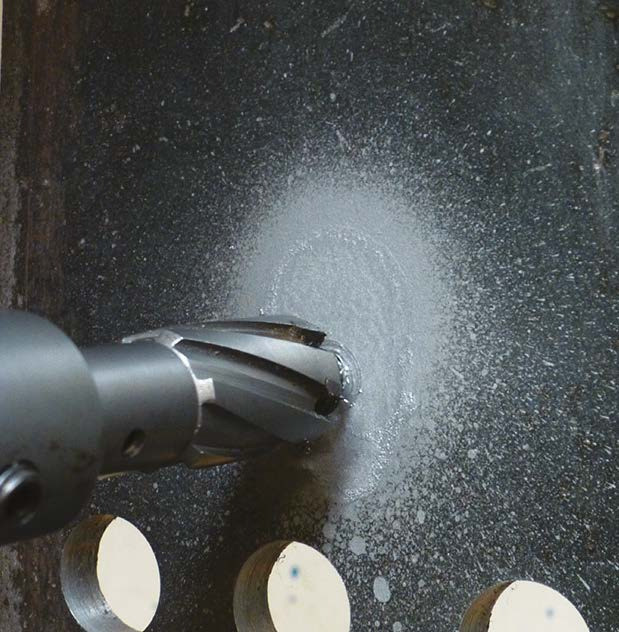 HMT Speedlube Drilling & Tapping Spray Aerosol – drilling lubricant being applied to a steel plate