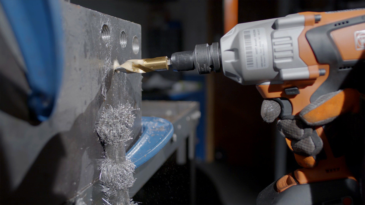 Cordless impact driver fitted with HMT adaptor machining steel