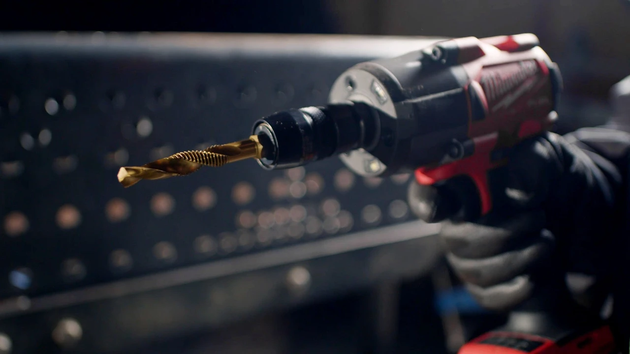 HMT VersaDrive Spiral Flute Combi Drill-Tap - Metric – impact driver drilling holes through a steel section