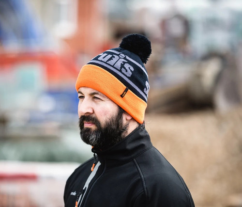 Scruffs Trade Orange Thinsulate Bobble Hat worn on site with black and orange knitted design