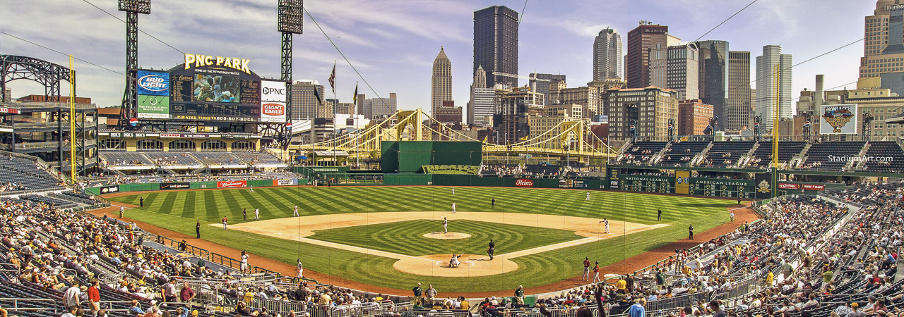 Aerial view of Pittsburgh, Pennsylvania, with a focus on the Allegheny  River and the (roundish) Pittsburgh Pirates' major-league baseball stadium, PNC  Park. The left three spans are known locally as the Three