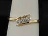LADIES YELLOW GOLD .25C DIAMOND 3 STONE WEDDING BAND