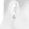 10K White Gold Baguette Diamond Huggie Ladies Oval Hoop Earrings 0.65" 0.50 CT.