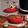 Cerise Le Creuset Signature Cast Iron Oval Casserole 35cm Lifestyle