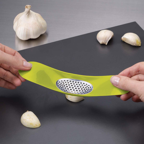 Green Joseph Joseph Rocker Plastic Garlic Crusher use