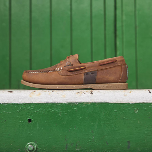 Chatham Mens Java II G2 Deck Shoes Lifestyle with Green fence