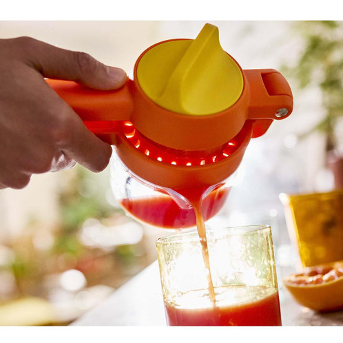 Orange Joseph Joseph JuiceMax Plus Citrus Juicer Lifestyle Pouring