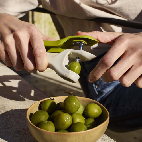 Joseph Joseph Tweezy 2-in-1 Pitter and Huller In Use Lifestyle