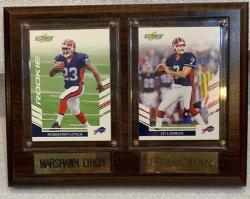 NFL Buffalo Bills Marshawn Lynch & J.P. Losman Plaque

Size: 6" x 8"
Score Rookie Card Of Marshawn Lynch #23 In Buffalo Bills Uniform
& Score Card of J.P. Losman #7 In Buffalo Bills Uniform