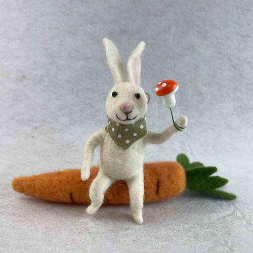 Felt Rabbit sitting on a carrot holding a mushroom 22.6x6x14.5cm