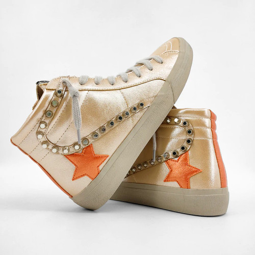 Gold high top sneaker with orange star 