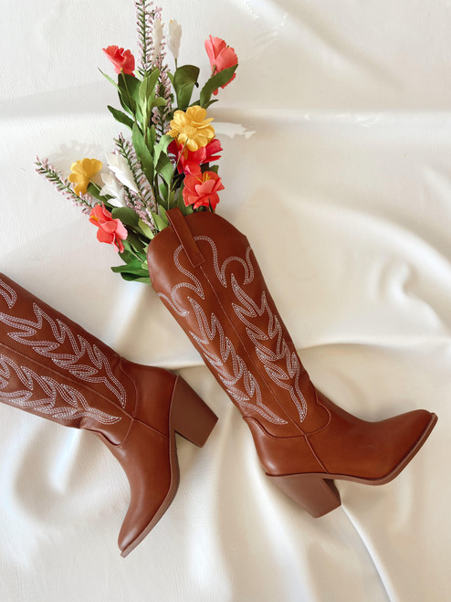Tall brown cowgirl boot