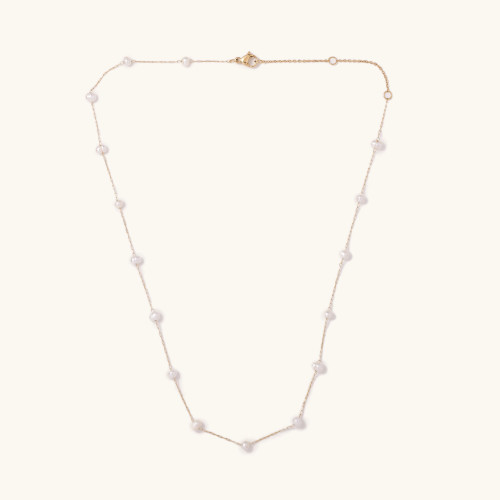 dainty gold necklace with floating pearls